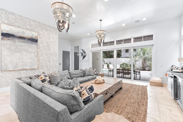 living room featuring a notable chandelier