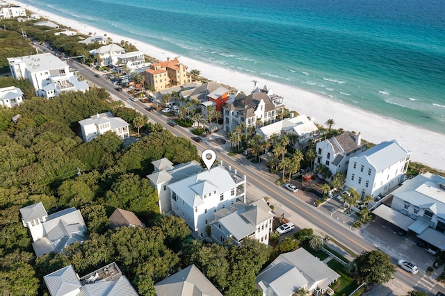 aerial view featuring a water view and a beach view