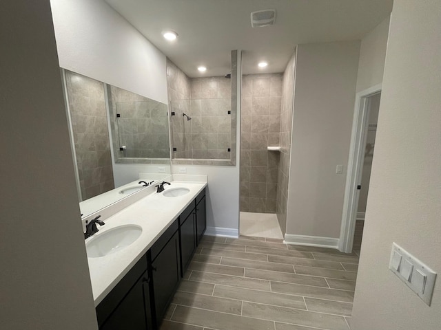 846 Coastal Breeze Dr, Freeport, FL 32439 - bathroom featuring a walk in shower, double vanity, baseboards, recessed lighting, and a spacious closet