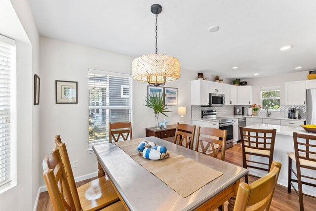 dining room featuring a chandelier and light hardwood / wood-style floors