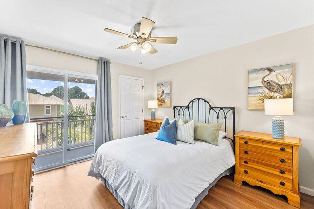 bedroom featuring access to exterior, ceiling fan, and light hardwood / wood-style floors