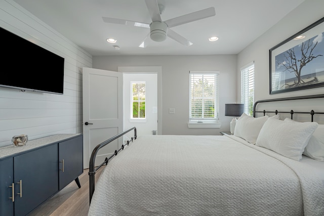 bedroom featuring ceiling fan and dark hardwood / wood-style floors