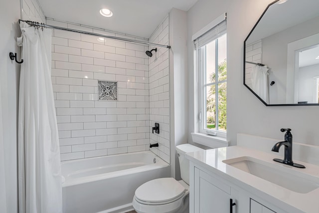 full bathroom with toilet, vanity, shower / tub combo with curtain, and a healthy amount of sunlight