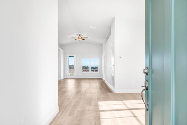 entryway with ceiling fan, lofted ceiling, and light hardwood / wood-style floors