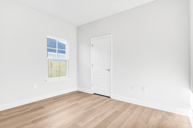 unfurnished room with light hardwood / wood-style flooring