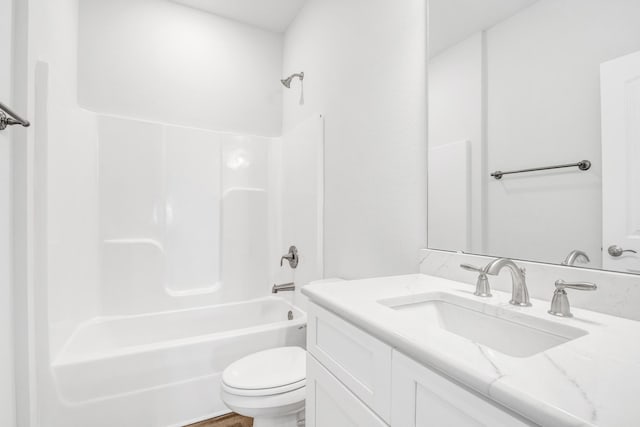 full bathroom with vanity, shower / tub combination, and toilet