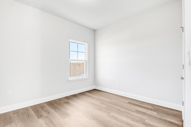 spare room featuring light hardwood / wood-style floors