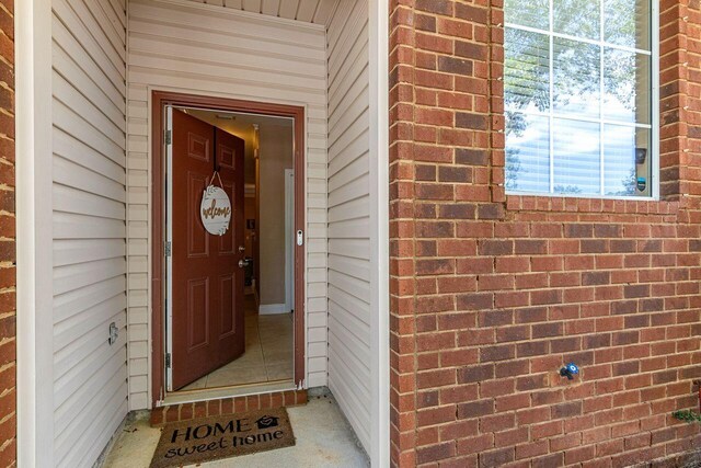 2240 Hadleigh Hills Ct, Navarre, FL 32566 - view of exterior entry with brick siding