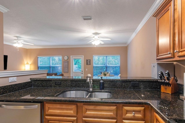 kitchen featuring a textured ceiling, dishwasher, ceiling fan, sink, and ornamental molding