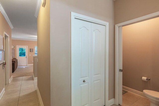 2240 Hadleigh Hills Ct, Navarre, FL 32566 - hall featuring light tile patterned floors, crown molding, and baseboards