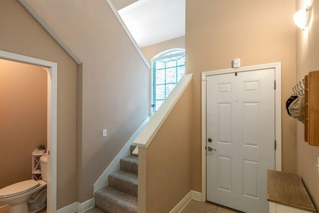2240 Hadleigh Hills Ct, Navarre, FL 32566 - foyer with baseboards and light tile patterned floors