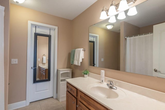 bathroom with vanity and tile patterned floors