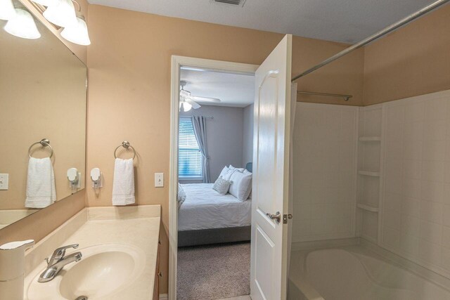 2240 Hadleigh Hills Ct, Navarre, FL 32566 - full bathroom featuring washtub / shower combination, vanity, and connected bathroom