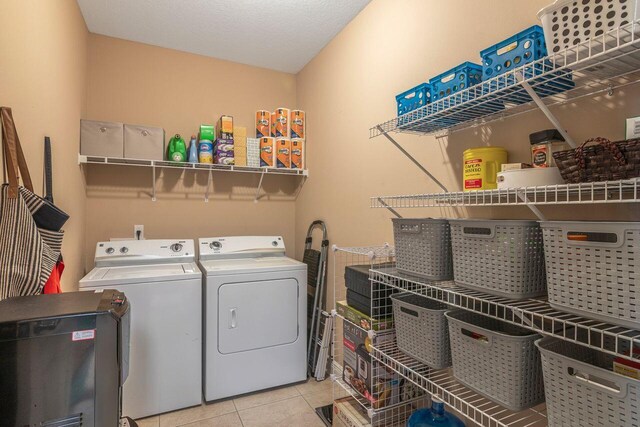 2240 Hadleigh Hills Ct, Navarre, FL 32566 - washroom with washer and dryer and light tile patterned floors