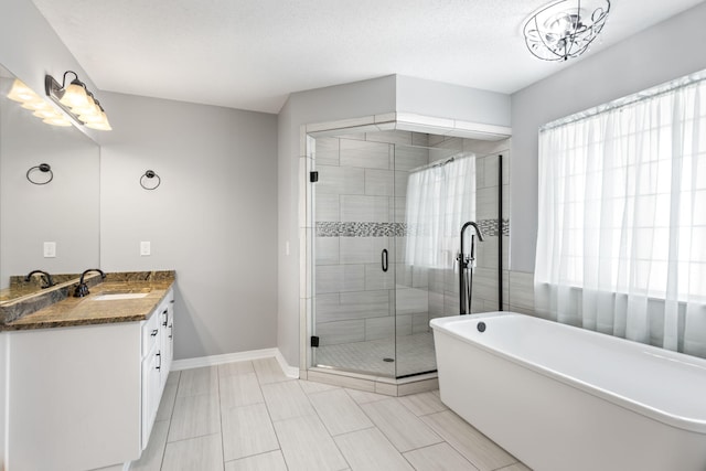 bathroom featuring vanity and shower with separate bathtub