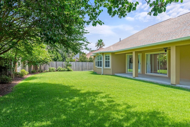 view of yard featuring ceiling fan