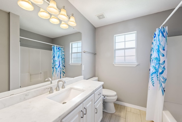 full bathroom with shower / bathtub combination with curtain, toilet, a wealth of natural light, and vanity