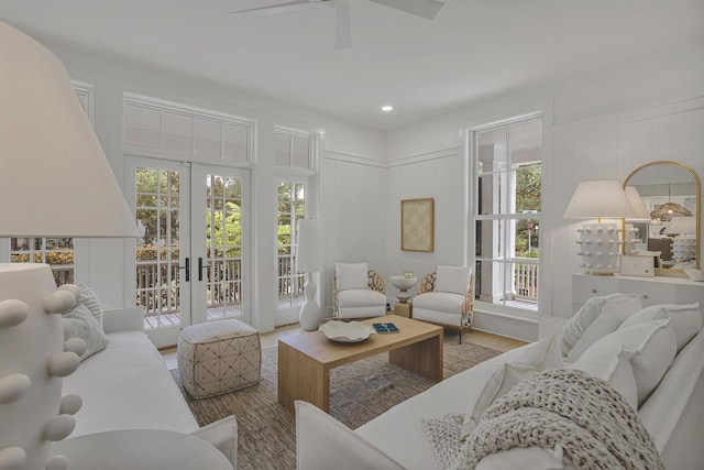 living room featuring french doors, hardwood / wood-style floors, and ceiling fan