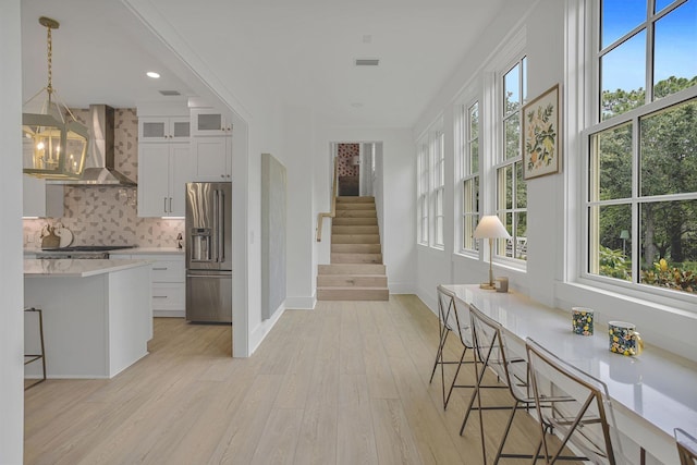 interior space featuring plenty of natural light and a notable chandelier