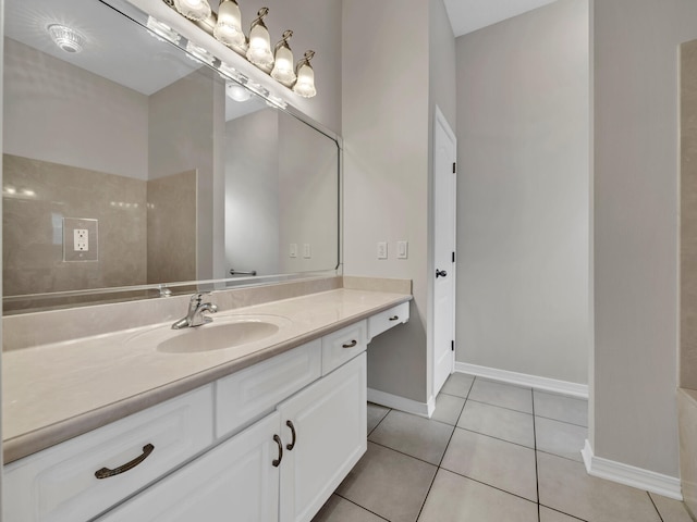 bathroom with tile patterned flooring and vanity