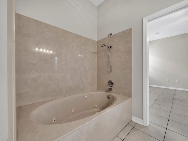 bathroom with tiled shower / bath combo and tile patterned floors