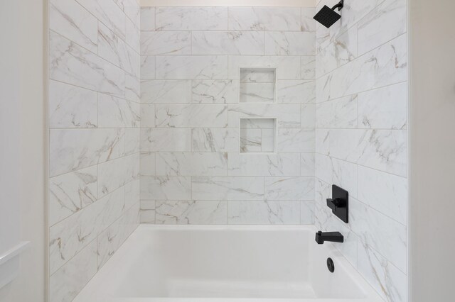 bathroom featuring washtub / shower combination