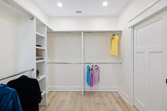 walk in closet featuring light wood-style floors