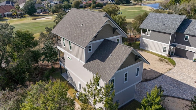 drone / aerial view featuring a residential view and golf course view