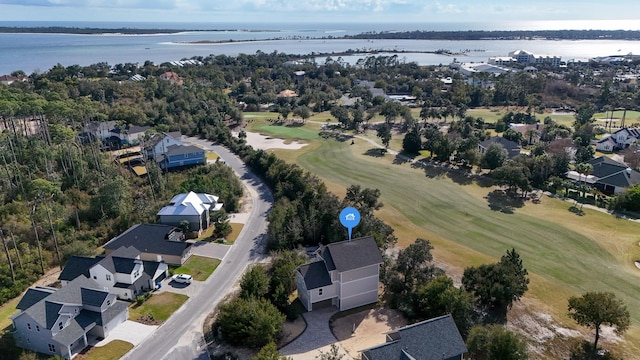 bird's eye view with golf course view and a water view