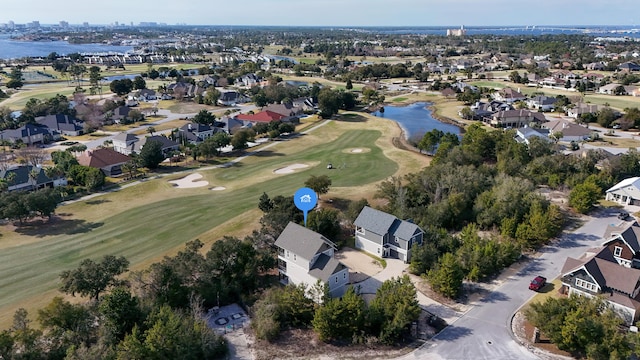 birds eye view of property with a residential view, golf course view, and a water view