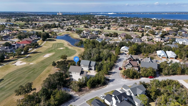 birds eye view of property featuring a residential view, a water view, and golf course view