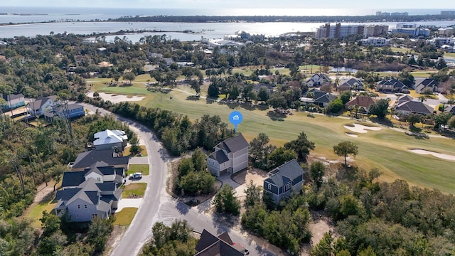 birds eye view of property featuring a residential view, a water view, and view of golf course