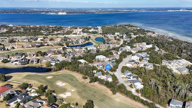 aerial view with a residential view, golf course view, and a water view