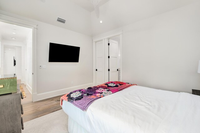 bedroom featuring ceiling fan and light hardwood / wood-style flooring