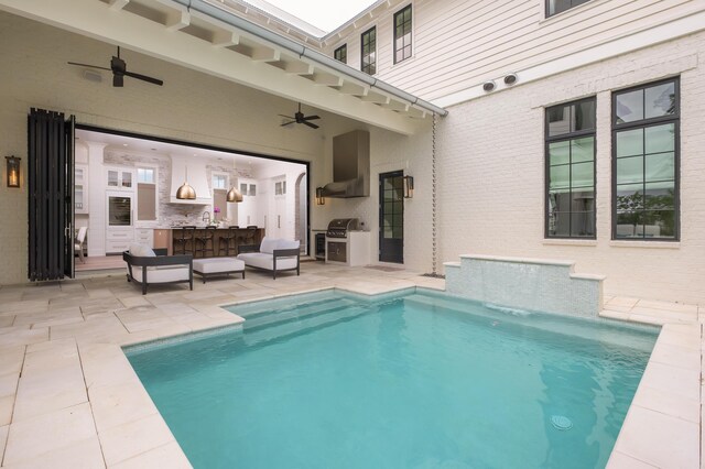 view of swimming pool with ceiling fan, an outdoor living space, a grill, and a patio