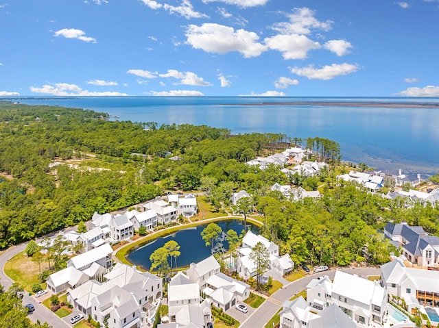 birds eye view of property featuring a residential view and a water view