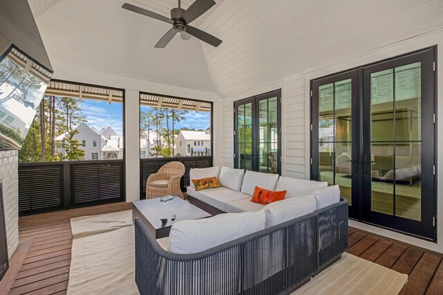 sunroom / solarium featuring ceiling fan, a healthy amount of sunlight, french doors, and lofted ceiling