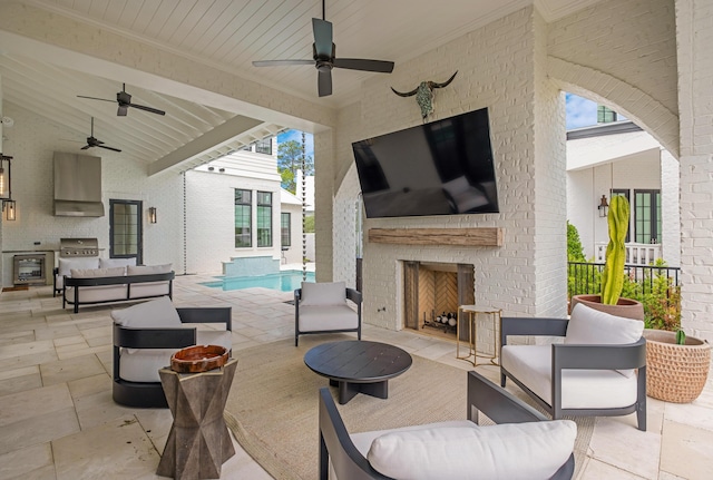 view of patio featuring an outdoor living space with a fireplace, grilling area, an outdoor kitchen, and an outdoor pool