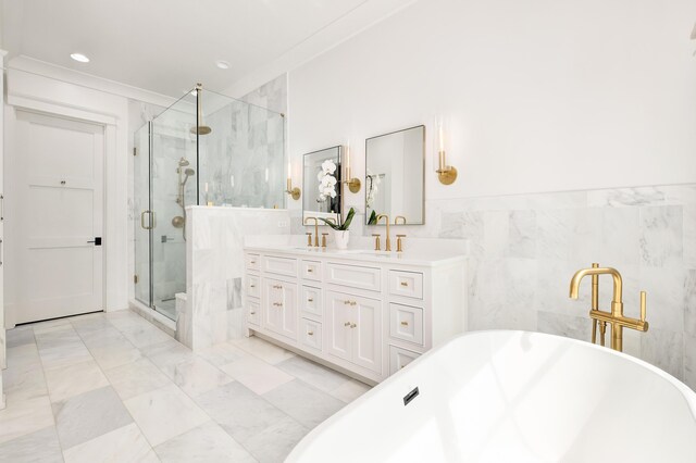 bathroom featuring plus walk in shower, tile walls, tile patterned floors, and vanity