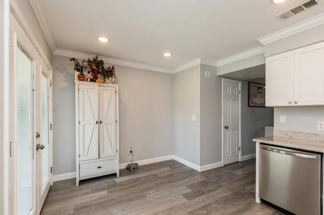 kitchen featuring ornamental molding, white cabinets, visible vents, and stainless steel dishwasher