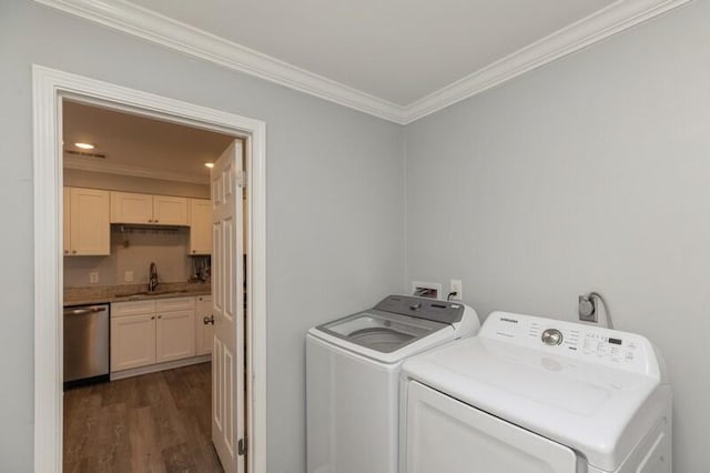 washroom featuring laundry area, a sink, ornamental molding, independent washer and dryer, and dark wood-style floors