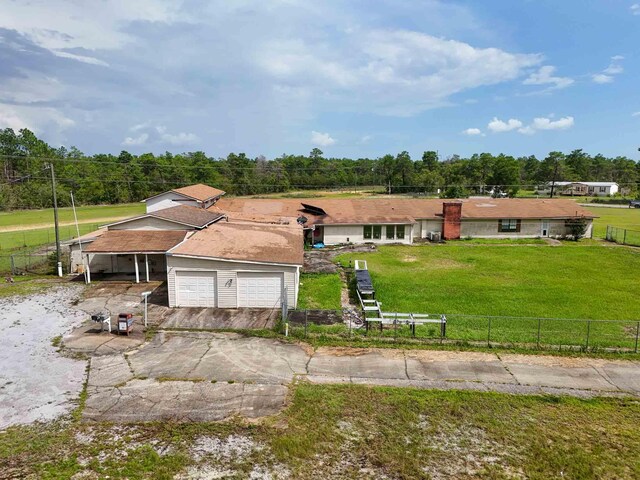 view of front of property with a garage and a front yard