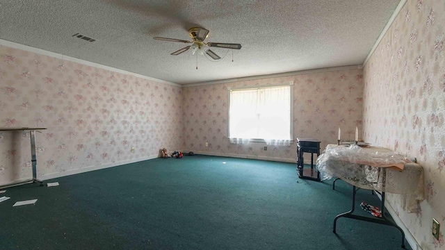 misc room with crown molding, a textured ceiling, ceiling fan, and carpet flooring