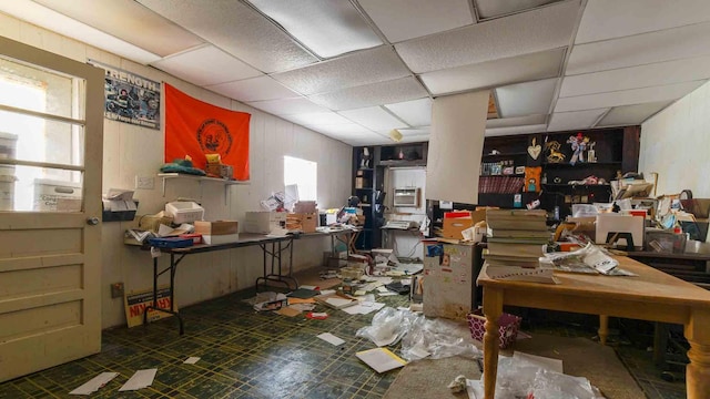 miscellaneous room featuring tile patterned flooring and a drop ceiling