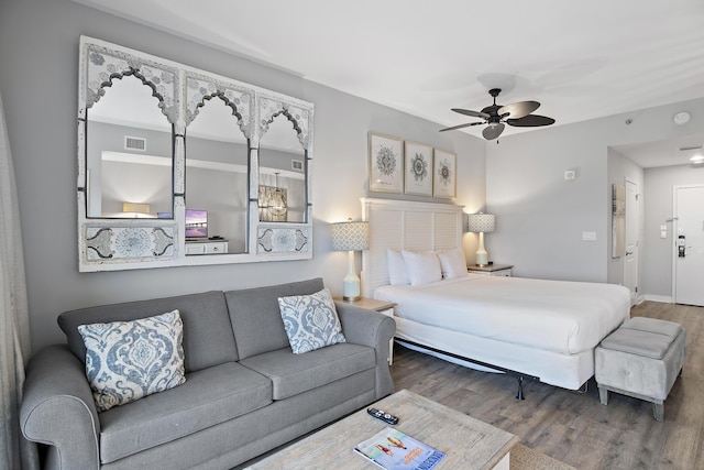 bedroom featuring hardwood / wood-style floors and ceiling fan