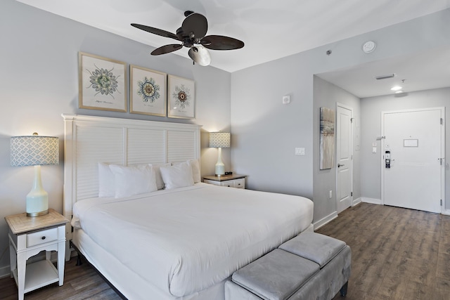 bedroom featuring ceiling fan and dark hardwood / wood-style flooring