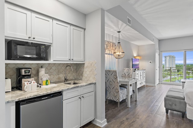 kitchen featuring sink, decorative light fixtures, stainless steel dishwasher, decorative backsplash, and white cabinets