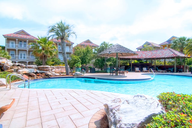 view of pool with a patio and a gazebo