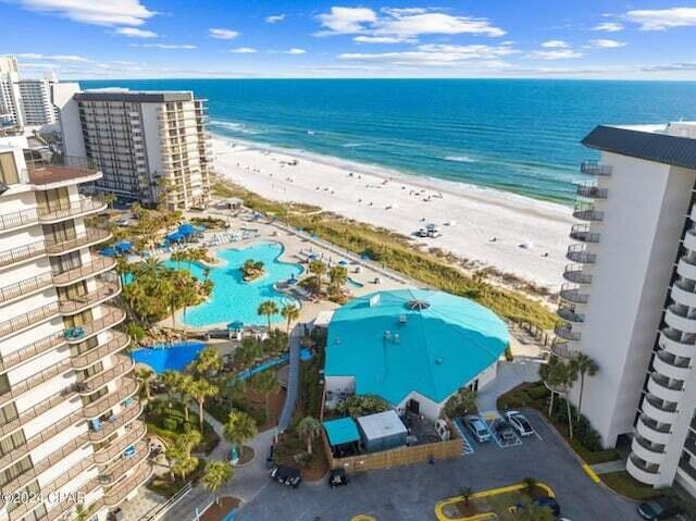 bird's eye view with a beach view and a water view