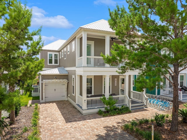 view of front facade with a garage and covered porch